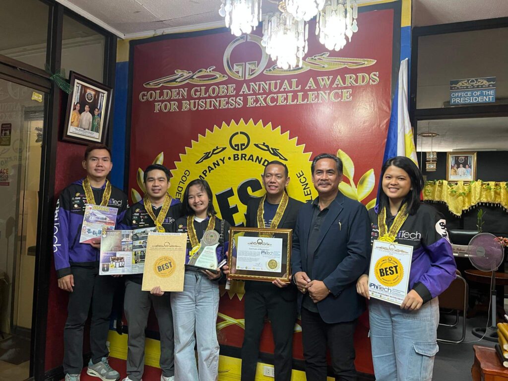 iPhiTech Representatives holding the certificates and awards given by the representative of Golden Globe Annual Awards for Business Excellence inside the Golden Globe office
